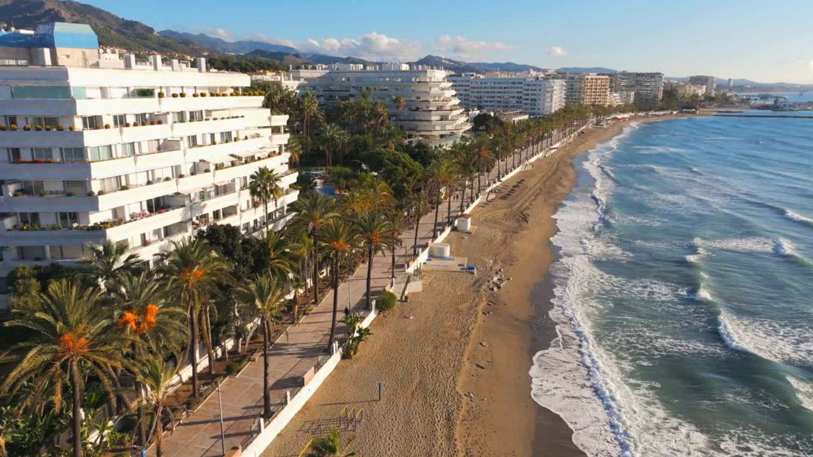 Aerial view of beachfront homes and the Mediterranean coastline on the Costa del Sol